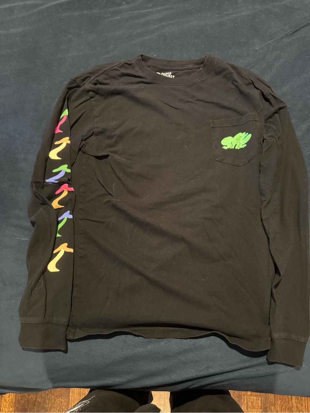 Black Long Sleeve Pocket Tee with Neon Green Frog and Multicolor Sleeve Prints